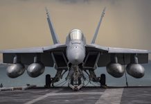 F/A-18E/F Super Hornet: A Versatile Combat Aircraft An F/A-18E Super Hornet, from the "Kestrels" of Strike Fighter Squadron (VFA) 137, rests on the flight deck of the aircraft carrier USS Nimitz (CVN 68) during a strait transit. (U.S. Navy photo by Mass Communication Specialist 3rd Class Elliot Schaudt/Released)